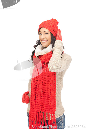 Image of beautiful woman in hat, muffler and mittens