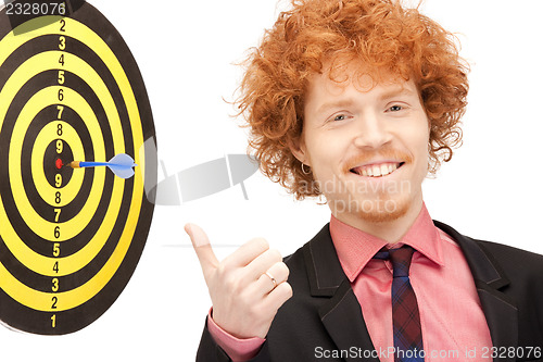 Image of businessman with dart and target