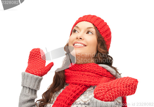 Image of beautiful woman in hat, muffler and mittens