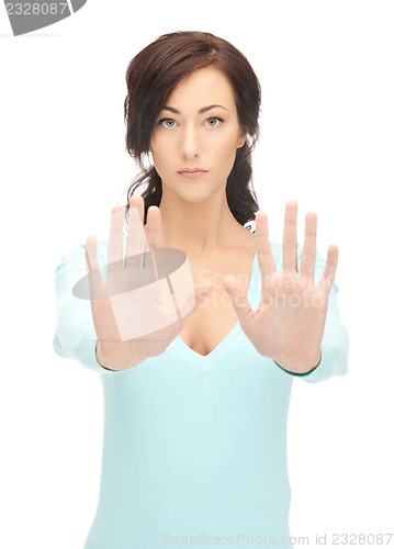 Image of woman making stop gesture