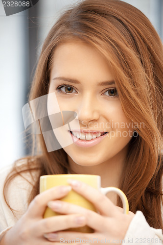 Image of lovely woman with mug