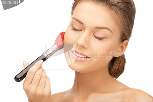 Image of beautiful woman with brush