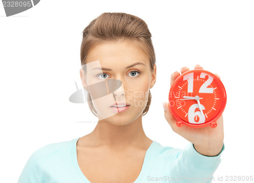 Image of woman holding alarm clock