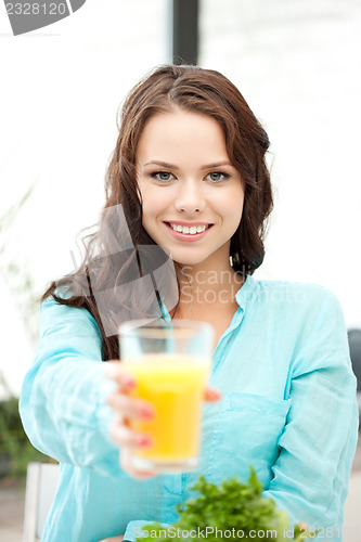 Image of beautiful woman with glass of juice