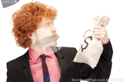 Image of man with dollar signed bag