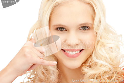 Image of woman making a call me gesture
