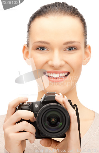 Image of teenage girl with digital camera