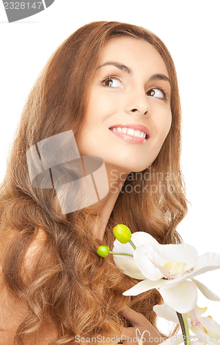 Image of beautiful woman with orchid flower