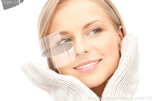Image of beautiful woman in mittens