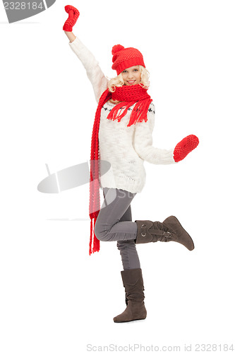 Image of beautiful woman in hat, muffler and mittens