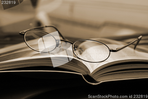 Image of Close up on the Glasses and the Magazine