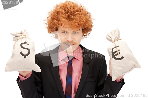 Image of man with euro and dollar bags