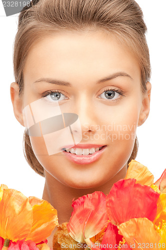 Image of lovely woman with red flowers
