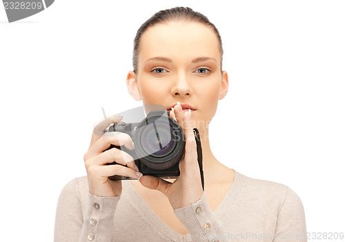 Image of teenage girl with digital camera