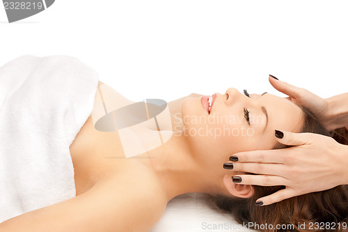 Image of beautiful woman in massage salon