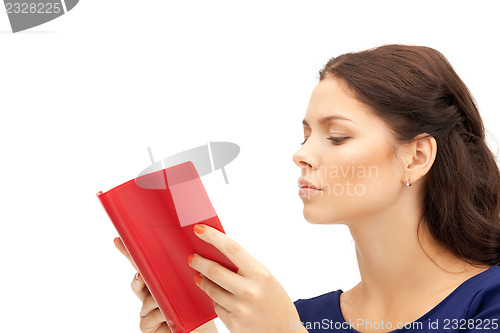Image of calm and serious woman with book