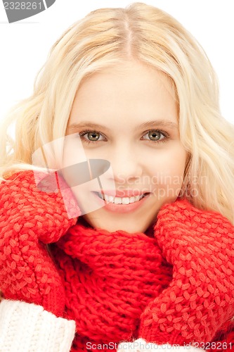 Image of beautiful woman in mittens