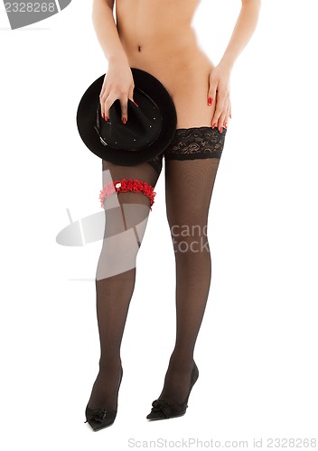 Image of playful girl in stockings on high heels
