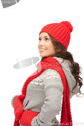 Image of beautiful woman in hat, muffler and mittens
