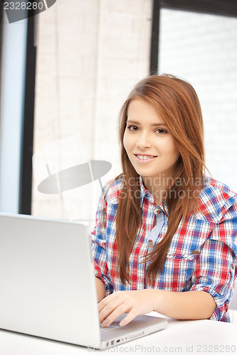 Image of happy woman with laptop computer
