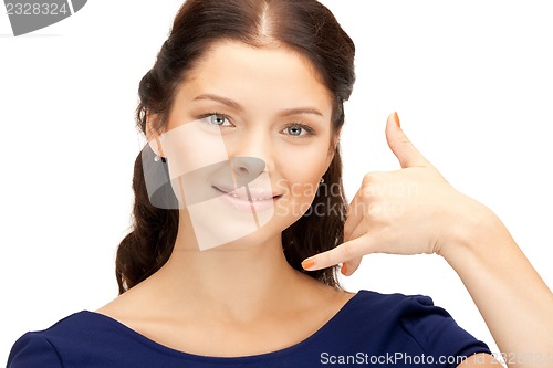 Image of woman making a call me gesture