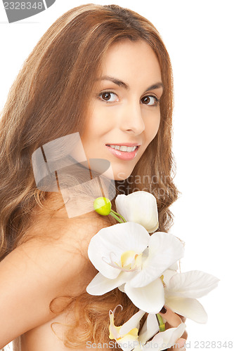 Image of beautiful woman with orchid flower