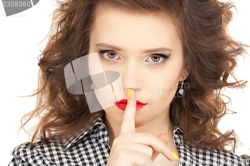 Image of finger on lips