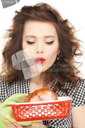 Image of lovely housewife with meat