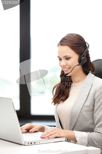 Image of helpline operator with laptop computer