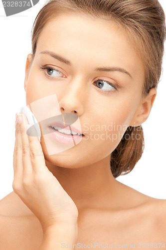 Image of beautiful woman with cotton pad