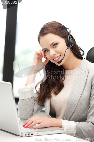 Image of helpline operator with laptop computer