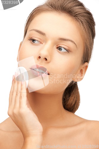 Image of beautiful woman with cotton pad