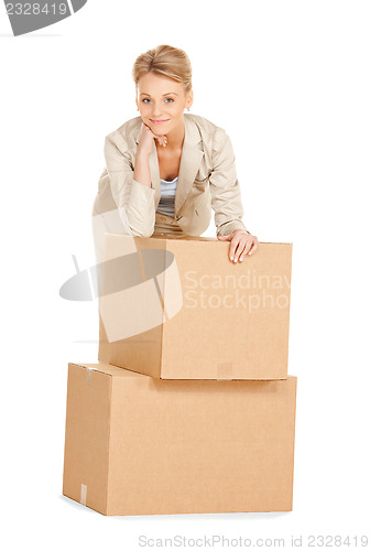 Image of attractive businesswoman with big boxes
