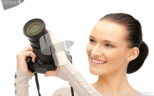 Image of teenage girl with digital camera