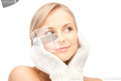 Image of beautiful woman in mittens