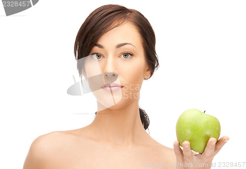 Image of young beautiful woman with green apple