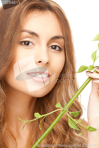 Image of woman with green sprout