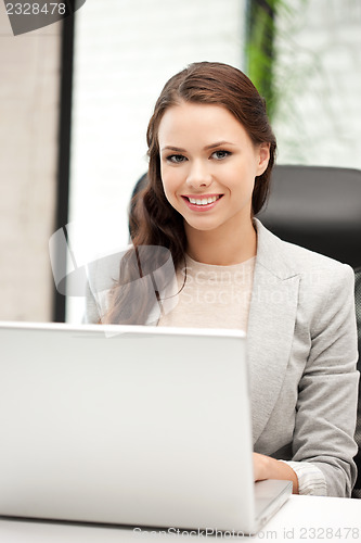 Image of happy woman with laptop computer