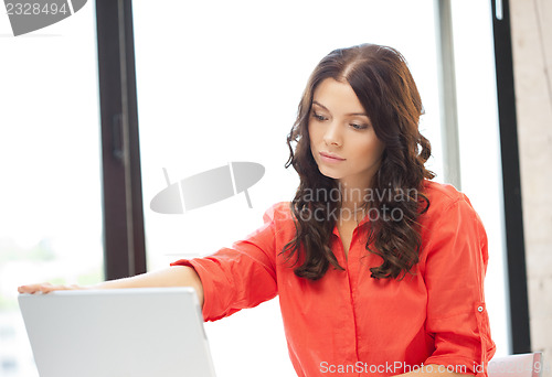 Image of happy woman with laptop computer