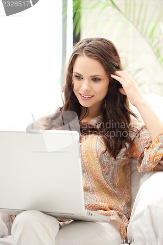 Image of happy woman with laptop computer