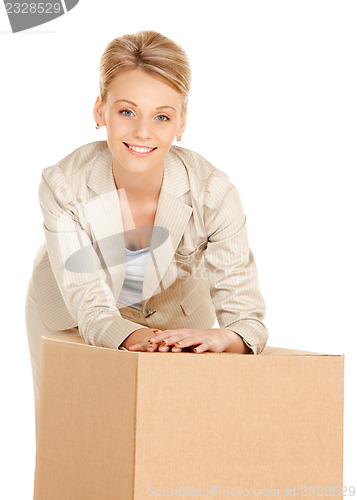 Image of attractive businesswoman with cardboard box