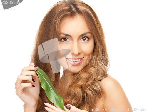 Image of woman with green leaf