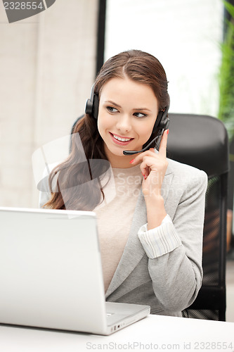 Image of helpline operator with laptop computer