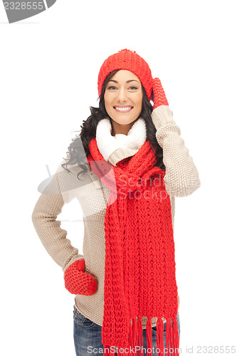 Image of beautiful woman in hat, muffler and mittens