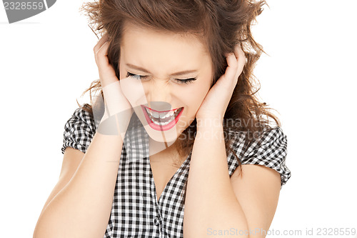 Image of woman with hands on ears