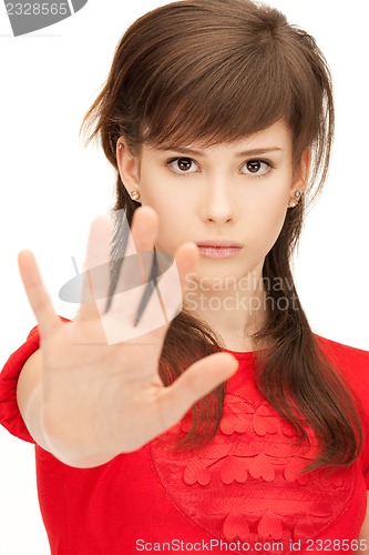 Image of teenage girl making stop gesture