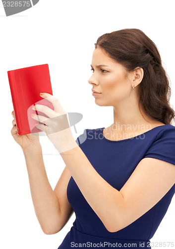 Image of calm and serious woman with book