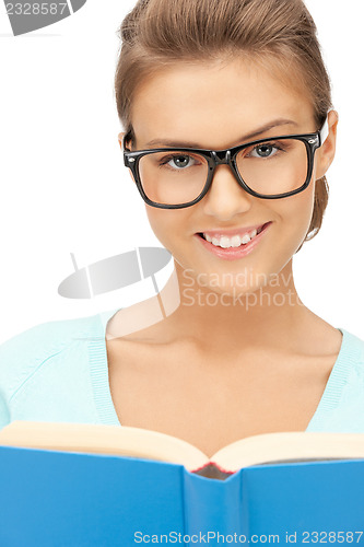 Image of happy and smiling woman with book