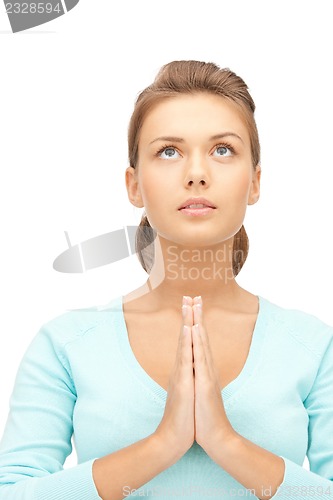 Image of praying businesswoman