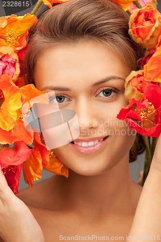 Image of lovely woman with red flowers